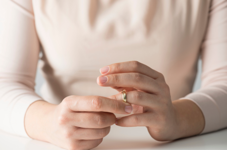 woman taking off ring