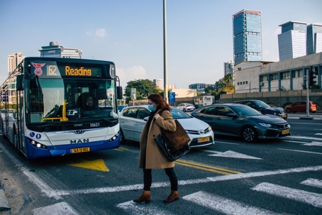 women walking across street