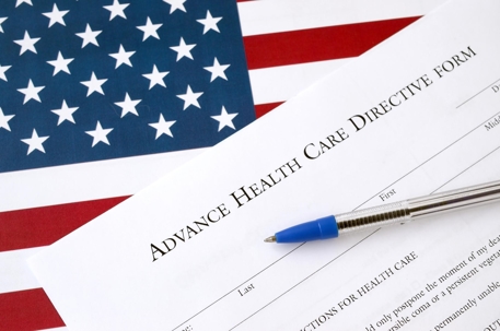 Advanced health care directive form on top of an American flag