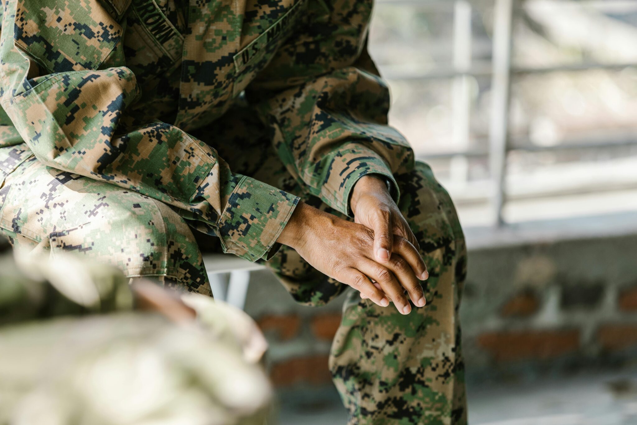 Military couple in uniform, representing the unique legal considerations involved in a military divorce.