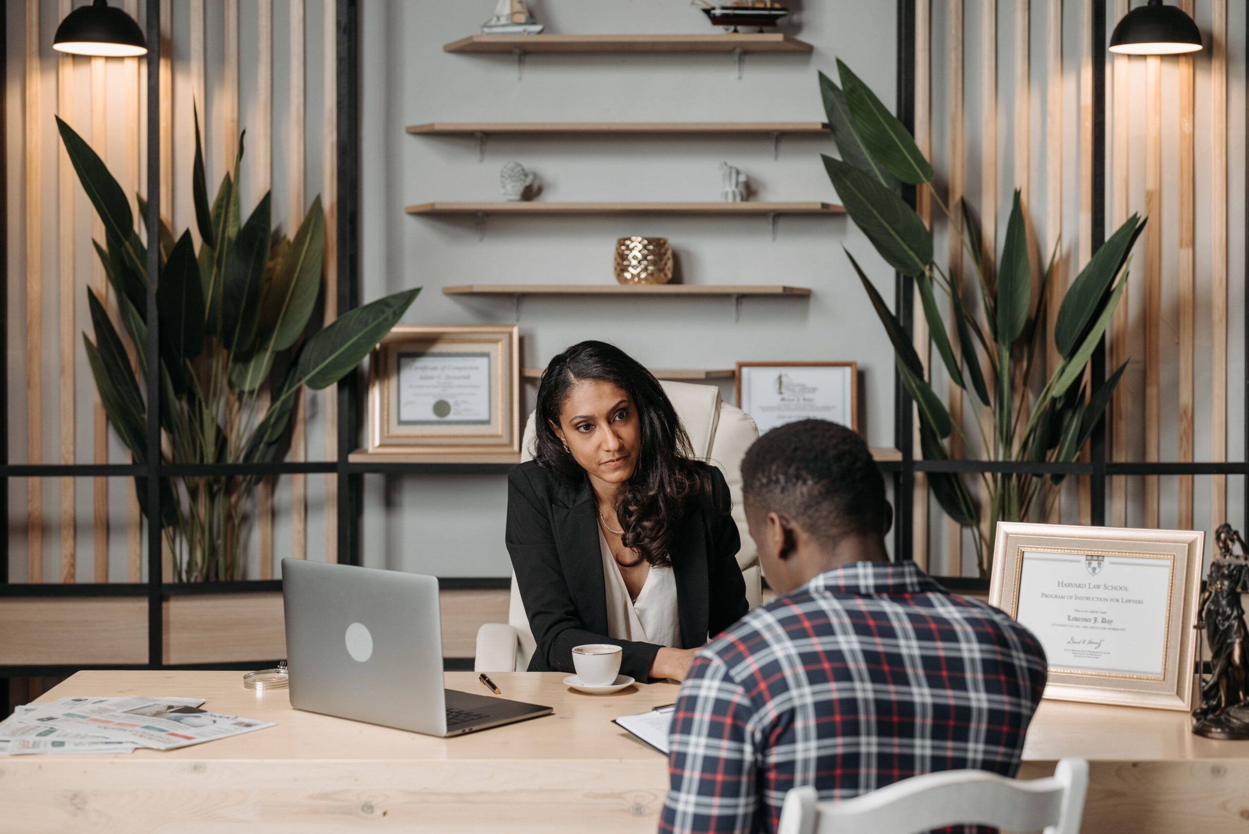 > A man talking to a lawyer during a legal consultation, representing professional guidance and representation through the Colorado divorce process.