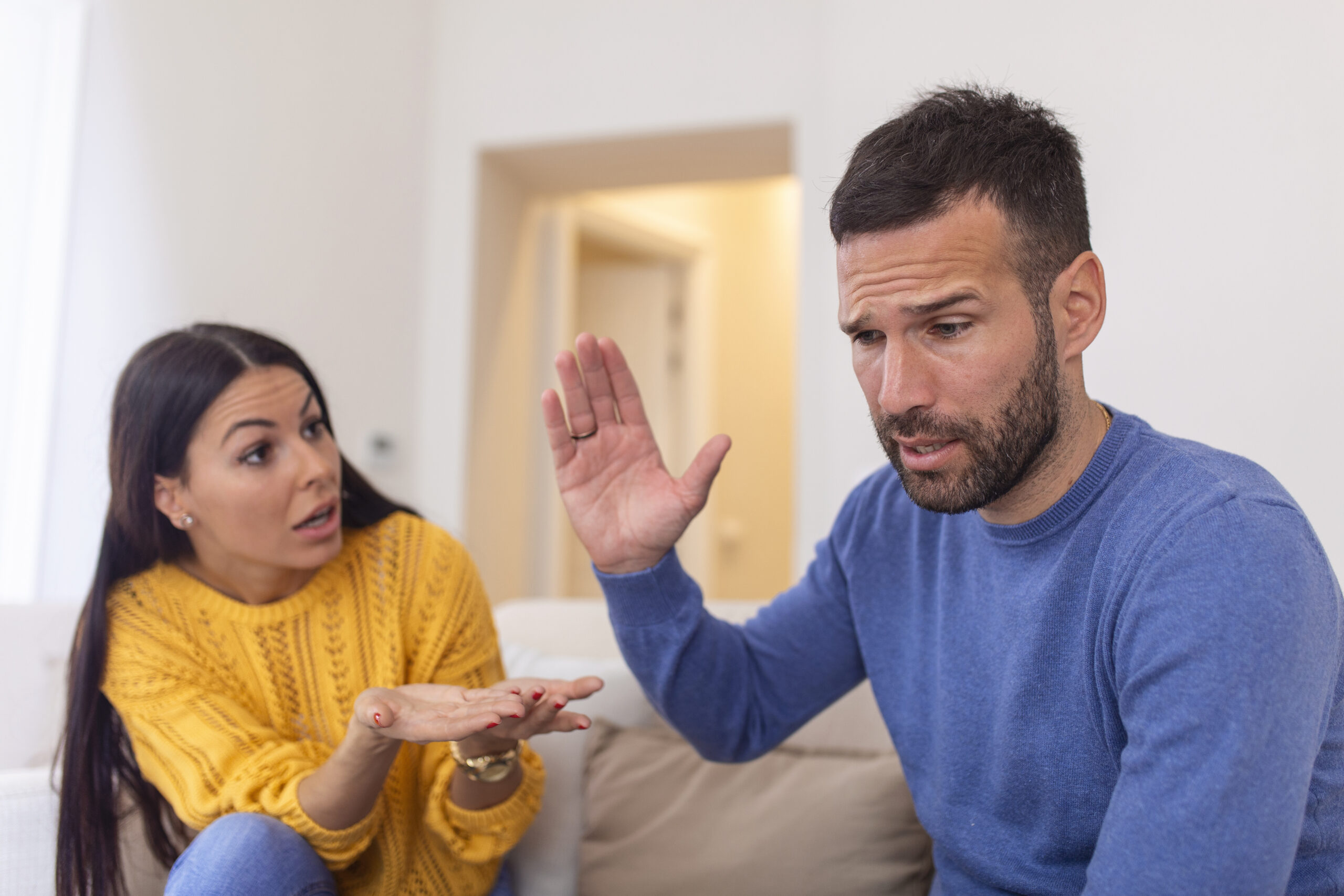 A man and woman arguing, representing the challenges and strategies involved in a high-conflict divorce in Colorado when a spouse won't cooperate.